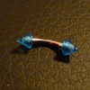 Piercing arcade bleu