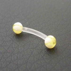 Piercing arcade jaune et blanc