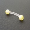 Piercing arcade jaune et blanc