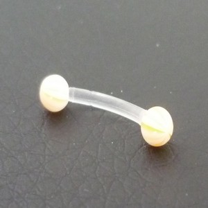 Piercing arcade jaune et blanc