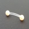 Piercing arcade jaune et blanc