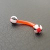 Piercing arcade orange, noir et blanc