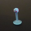 Piercing labret bleu, rouge et blanc