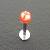 Piercing labret rouge et blanc