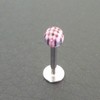 Piercing labret noir, rouge et blanc