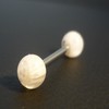 Piercing langue blanc motif : tête de mort