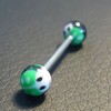 Piercing langue noir, vert et blanc