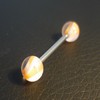 Piercing langue orange et blanc