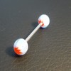 Piercing langue orange, blanc et bleu motif : feuille