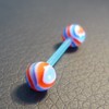 Piercing langue rouge, bleu et blanc