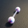 Piercing langue noir, rose et blanc motif : papillon