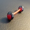 Piercing langue noir et rouge motif : coeur