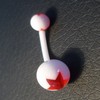 Piercing nombril orange et blanc